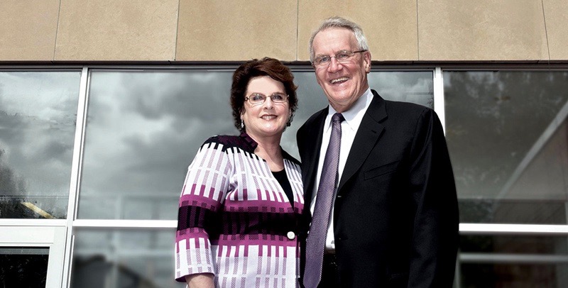 Dana and David Dornsife in front of the Dornsife School of Public Health at Drexel University